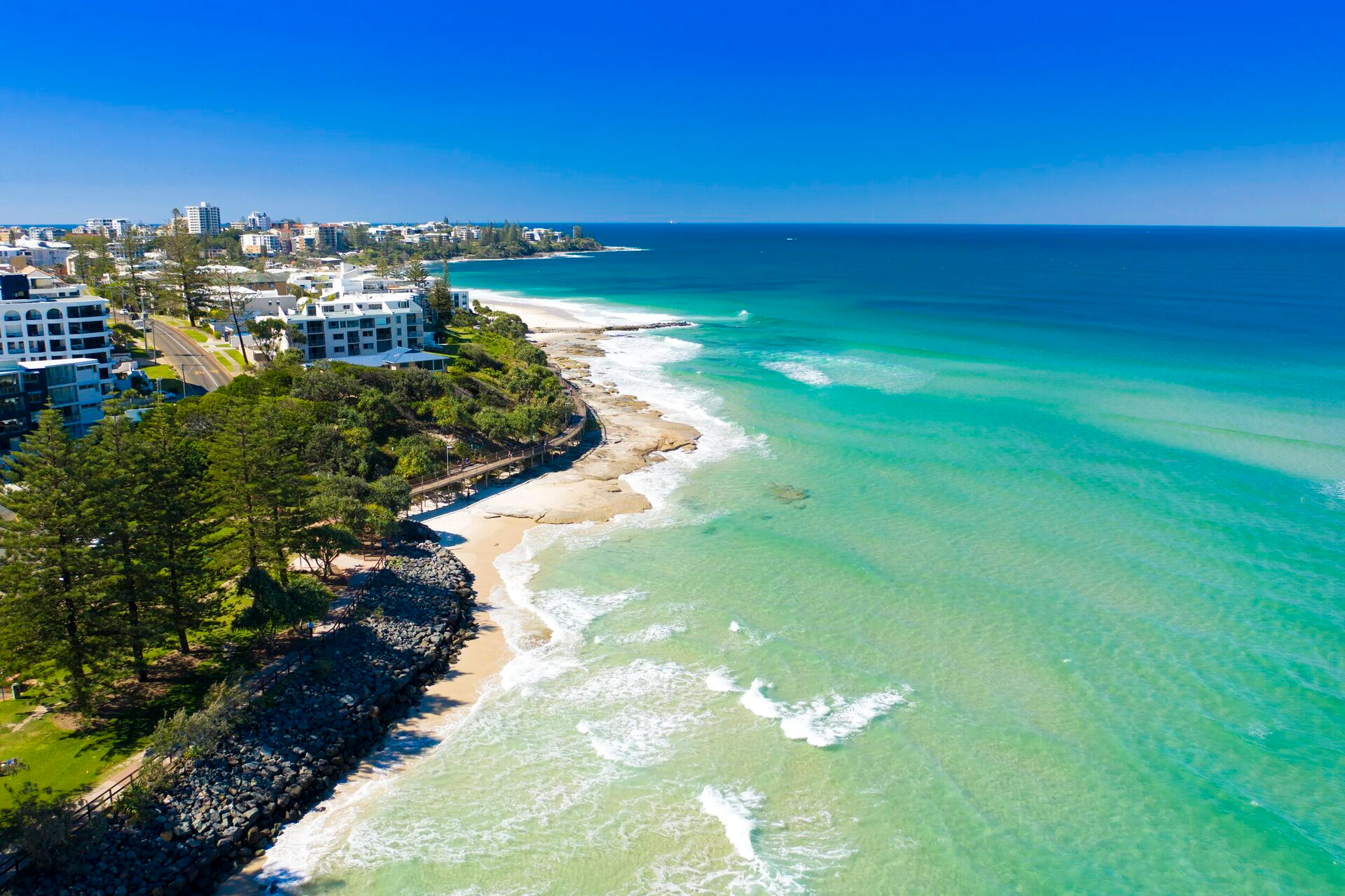 Aerial view of Kings Beach coastline near Kings Bay Apartments